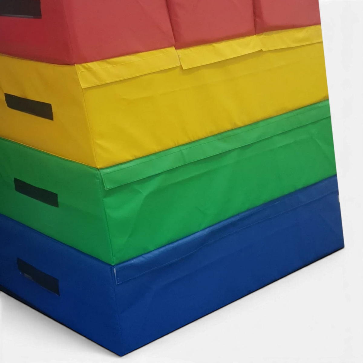 UK Gym Pits 4-tiered foam vault box with multi-coloured PVC sections and a triple-divided top for gymnastics training