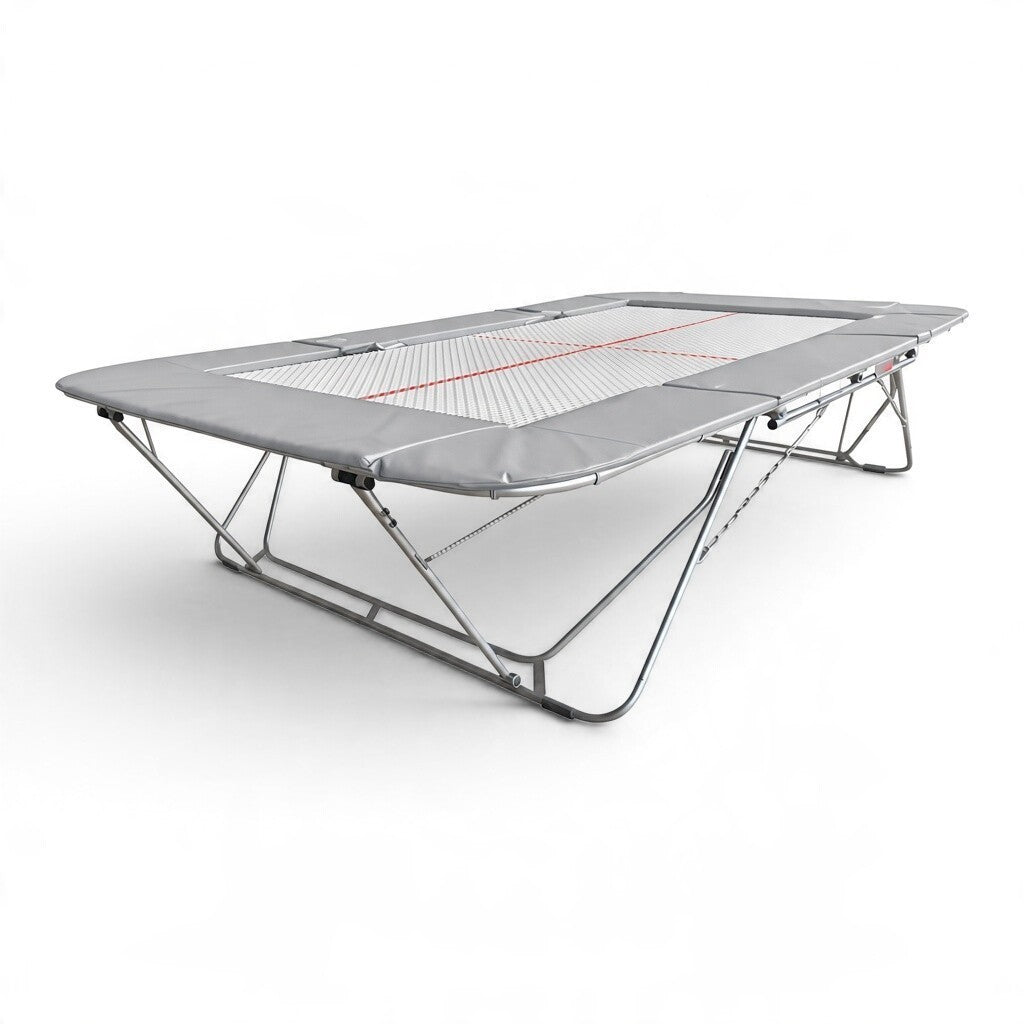 UK Gym Pits 77a professional competition trampoline with a 25mm web bed and grey protective frame pads