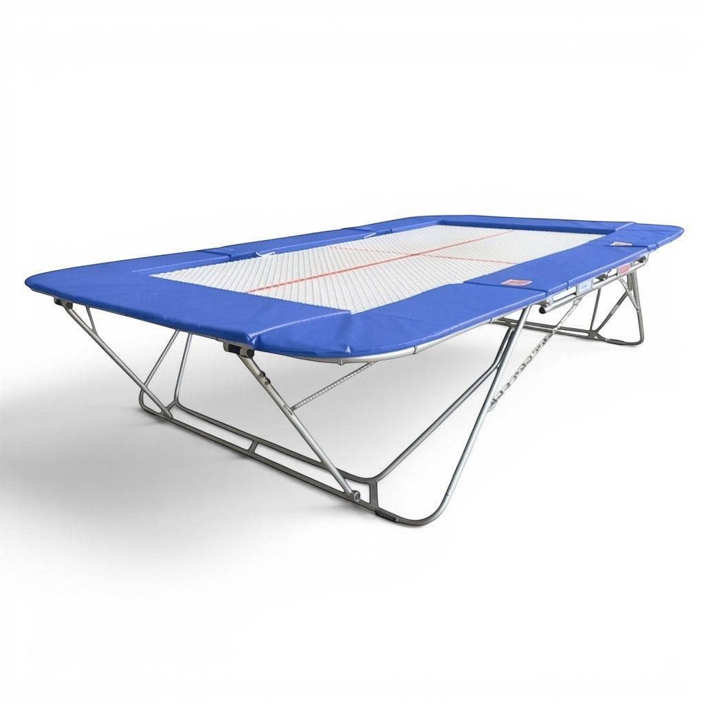 UK Gym Pits 77a standard competition trampoline with blue frame pads and a 25mm web bed for gymnastic training