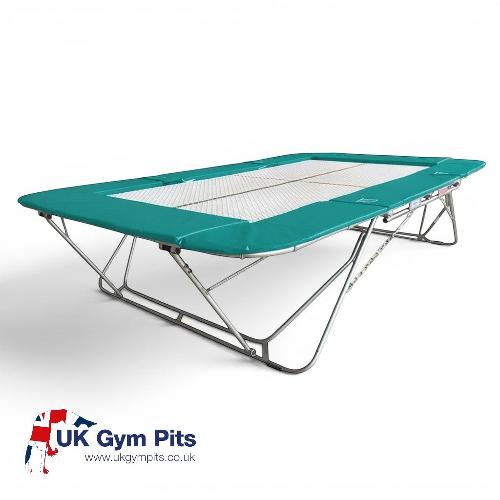 UK Gym Pits 77a standard competition trampoline with a 25mm web bed and teal protective frame pads