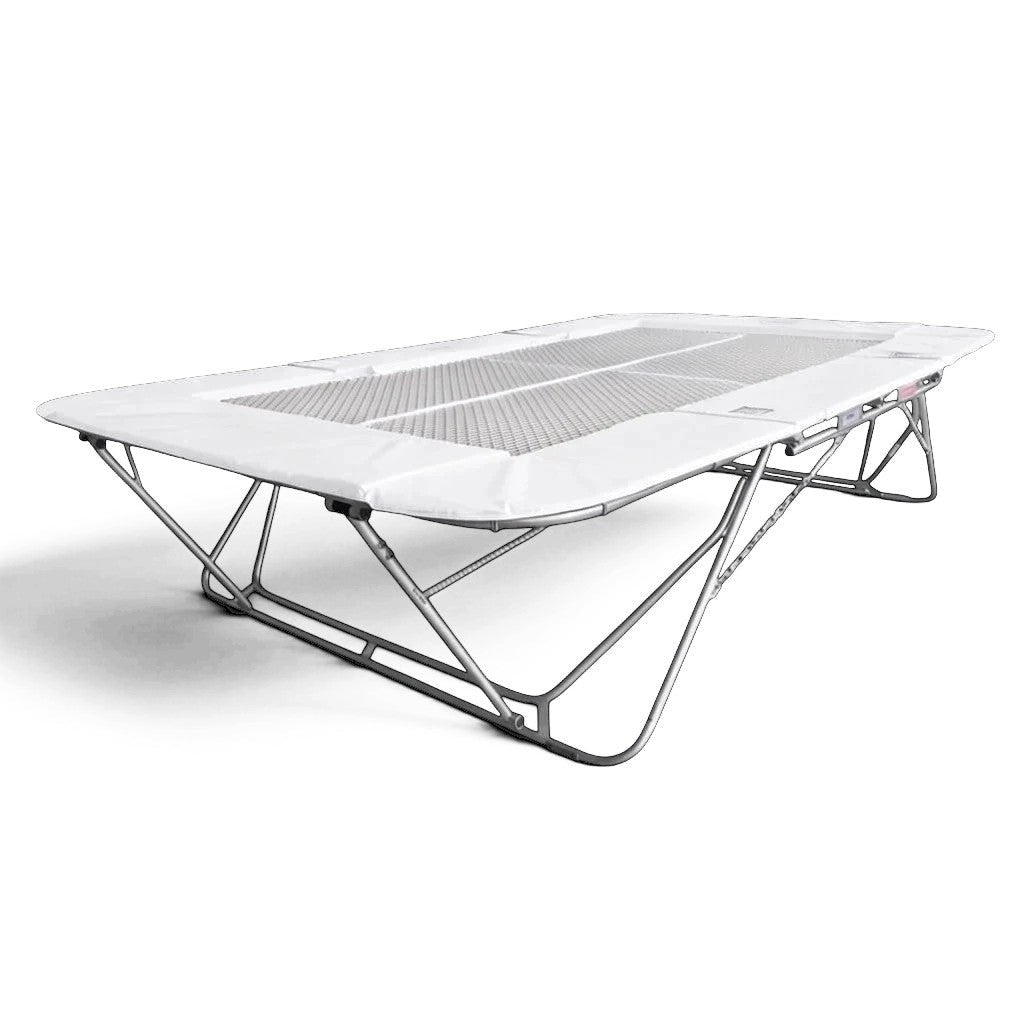 UK Gym Pits 77a standard trampoline with a white super-mesh bed and protective frame pads on a steel frame.
