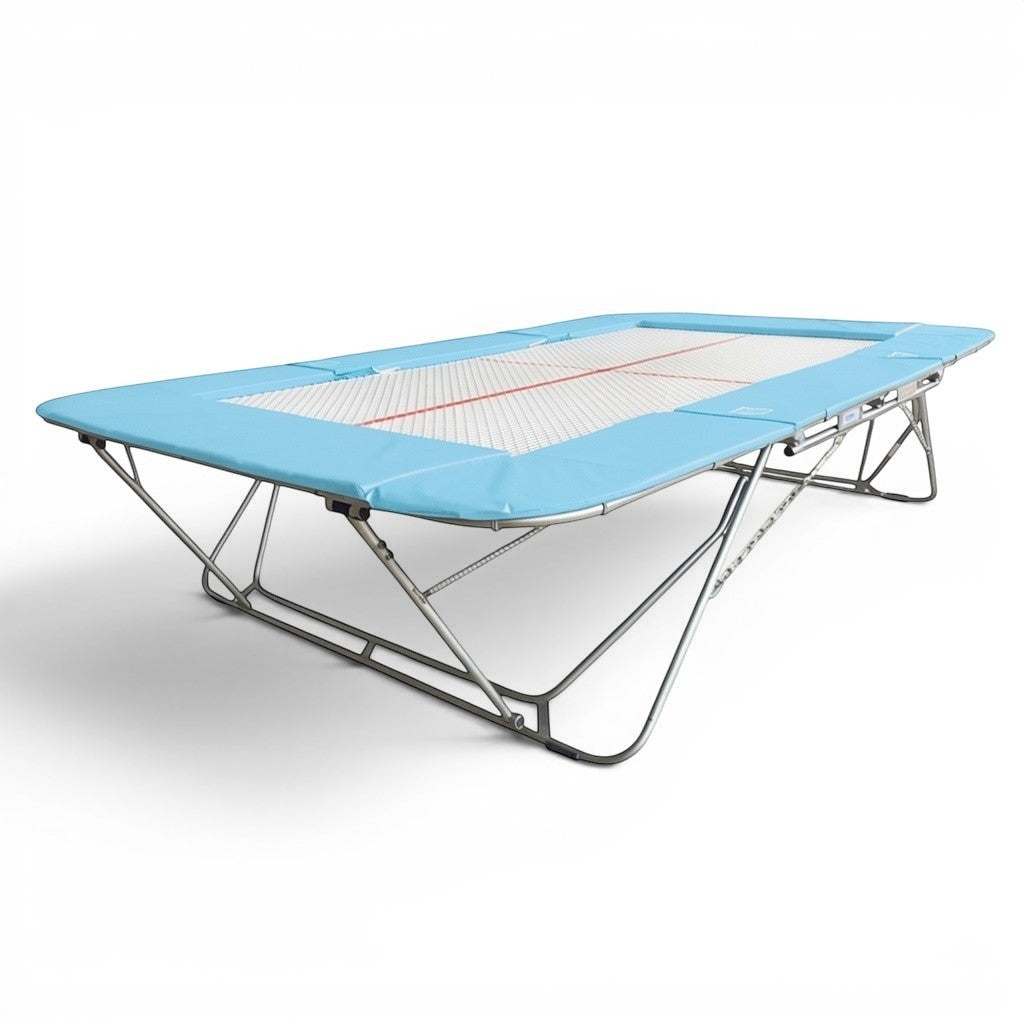 UK Gym Pits 77a standard competition trampoline with a 25mm web bed and light blue protective frame pads