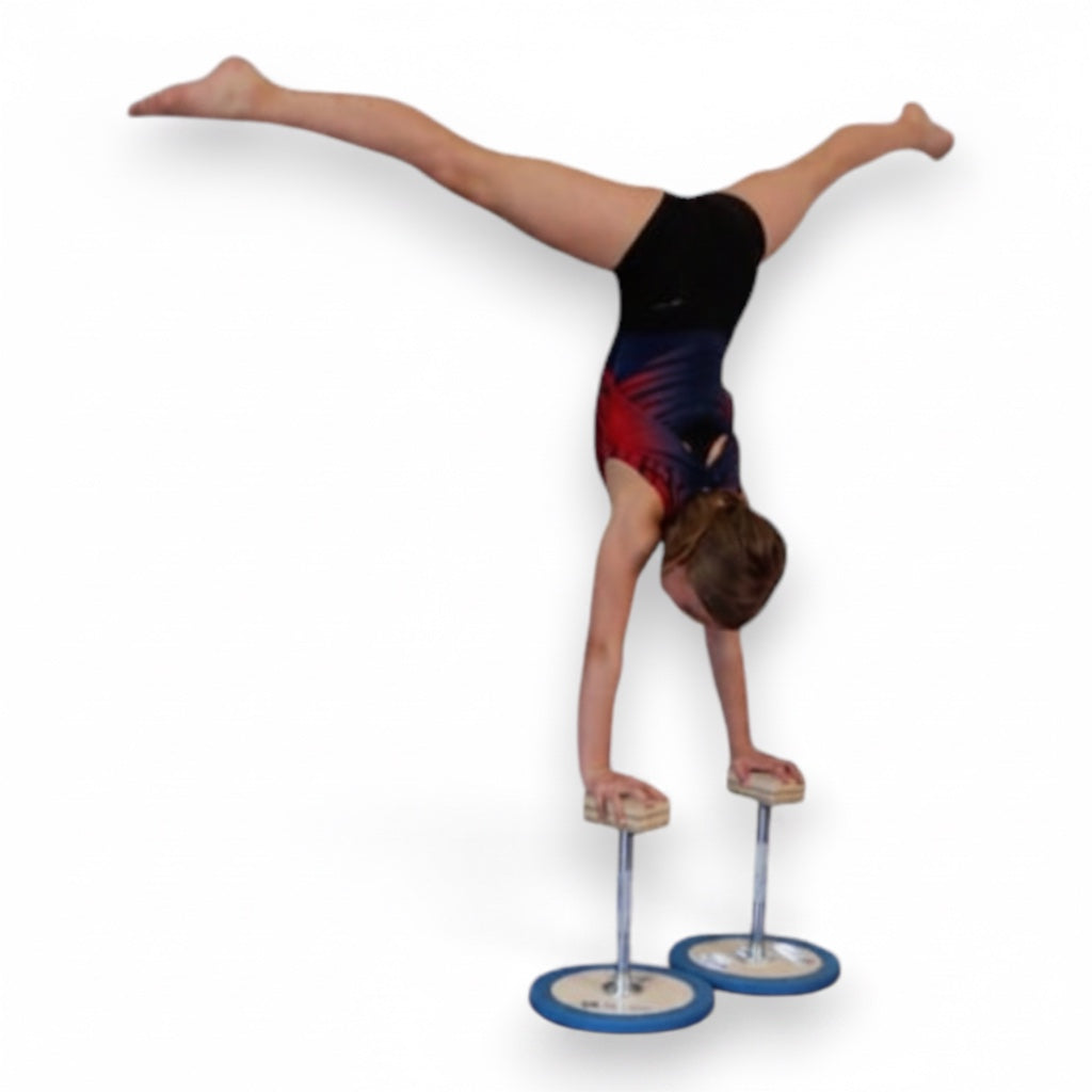 Gymnast performing a handstand on UK Gym Pits 3 in 1 adjustable wooden handstand canes with steel posts