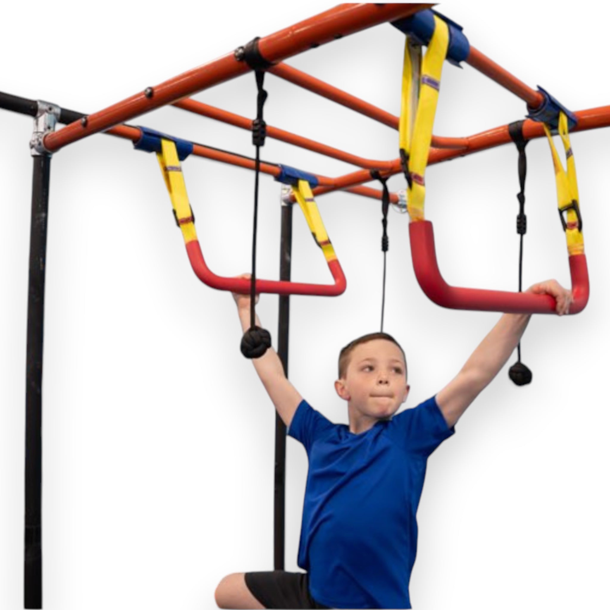 UK Gym Pits adjustable trapeze bar with red rubber grip and yellow straps being used by a boy in a gymnastics gym