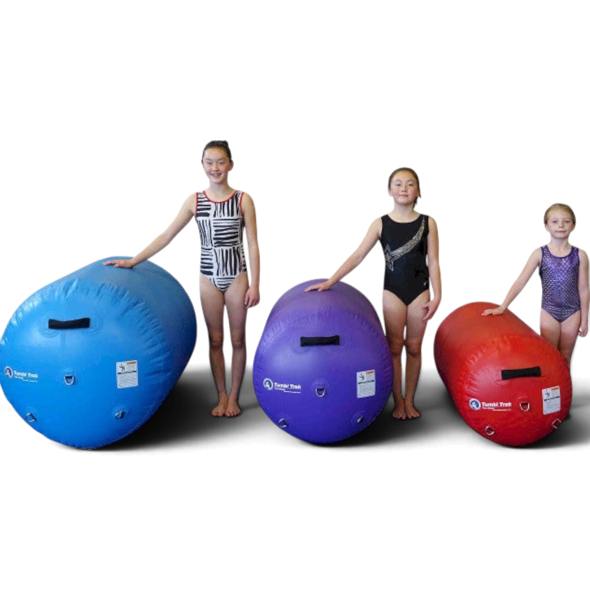UK Gym Pits air barrels in blue, purple, and red sizes with young gymnasts for scale against a black background