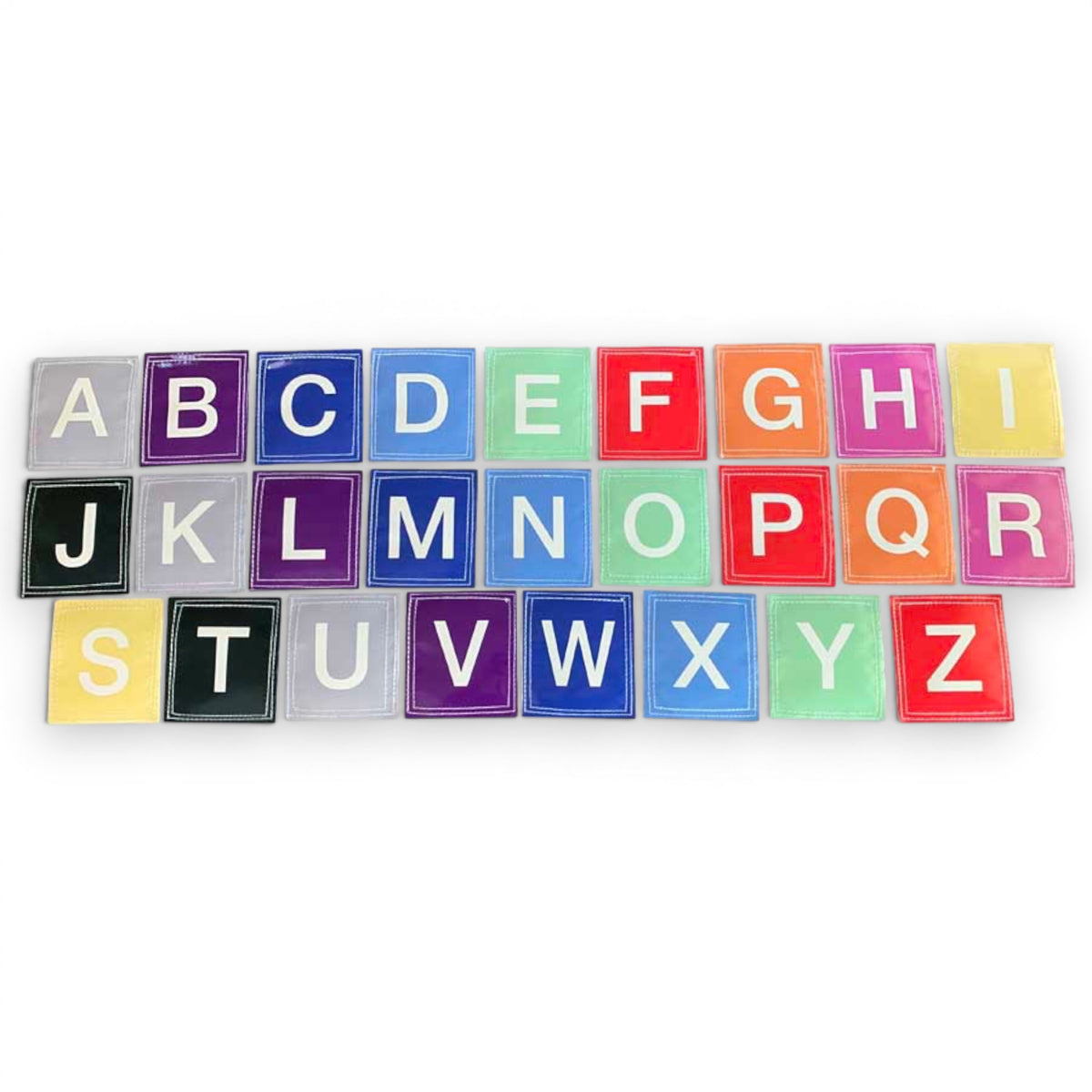 UK Gym Pits set of 26 colourful vinyl alphabet squares with white letters and velcro backing for educational play.