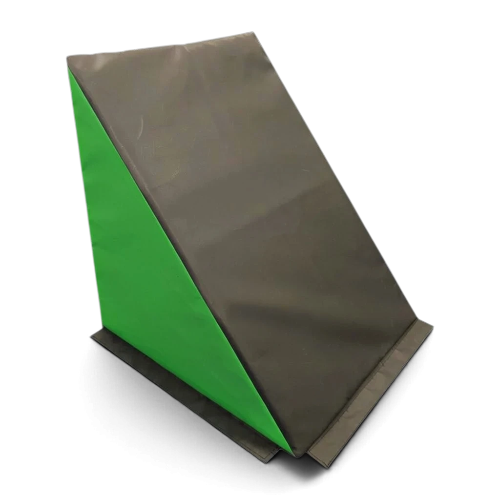 UK Gym Pits black and green wedge-shaped foam ninja step for parkour and obstacle course training.