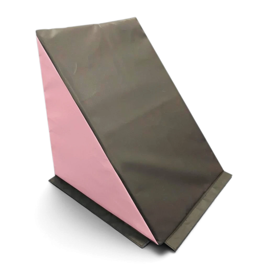 UK Gym Pits black and pink wedge-shaped parkour ninja step made of heavy-duty PVC with a non-slip base.
