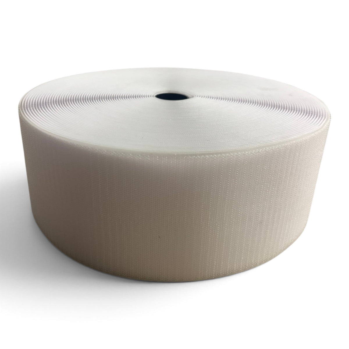 UK Gym Pits white hook roll for joining carpet mat rolls, 10cm wide and 25m long for seamless gym mat connections.