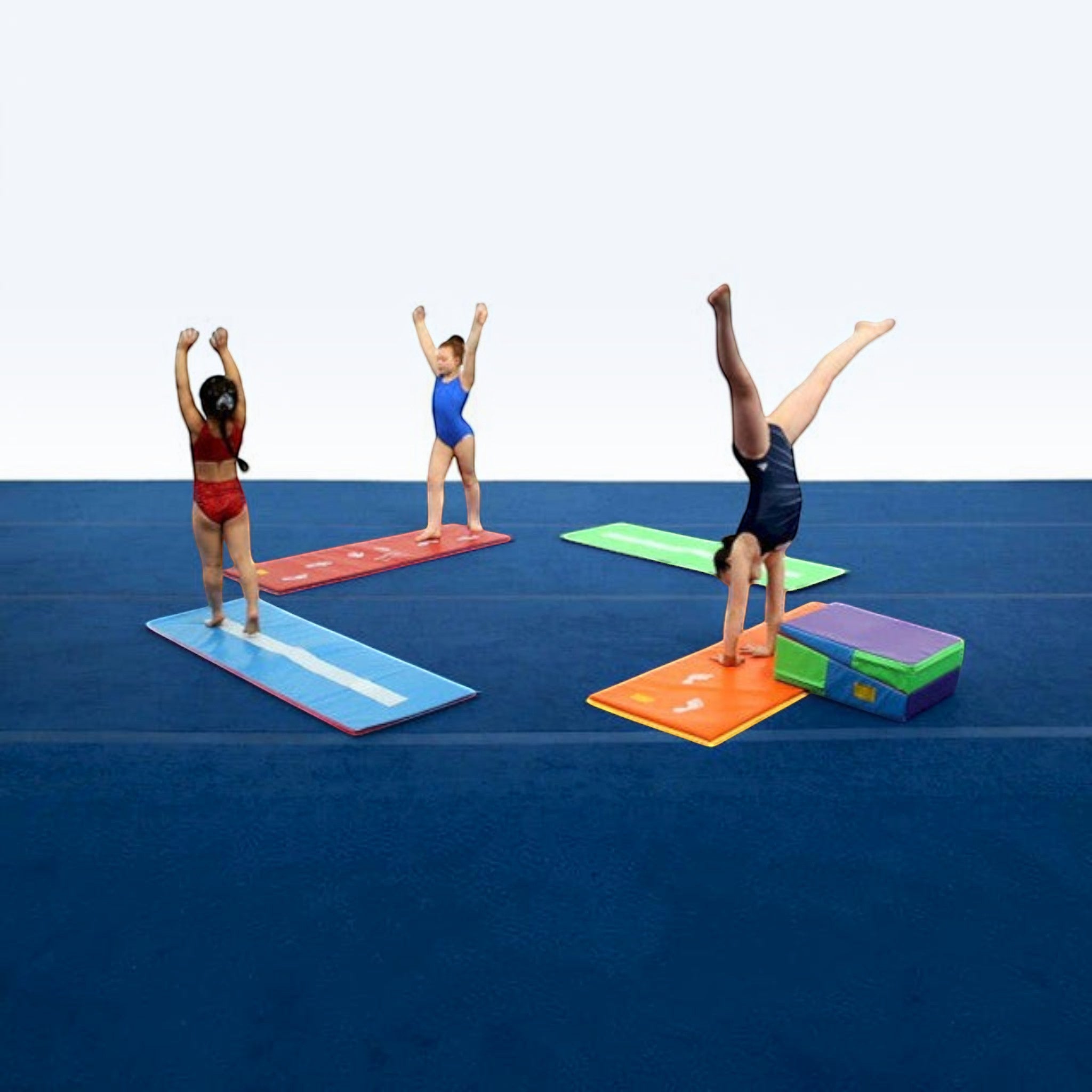 UK Gym Pits colourful tumbling mats with beam stripes and hand guides being used by young gymnasts for practice