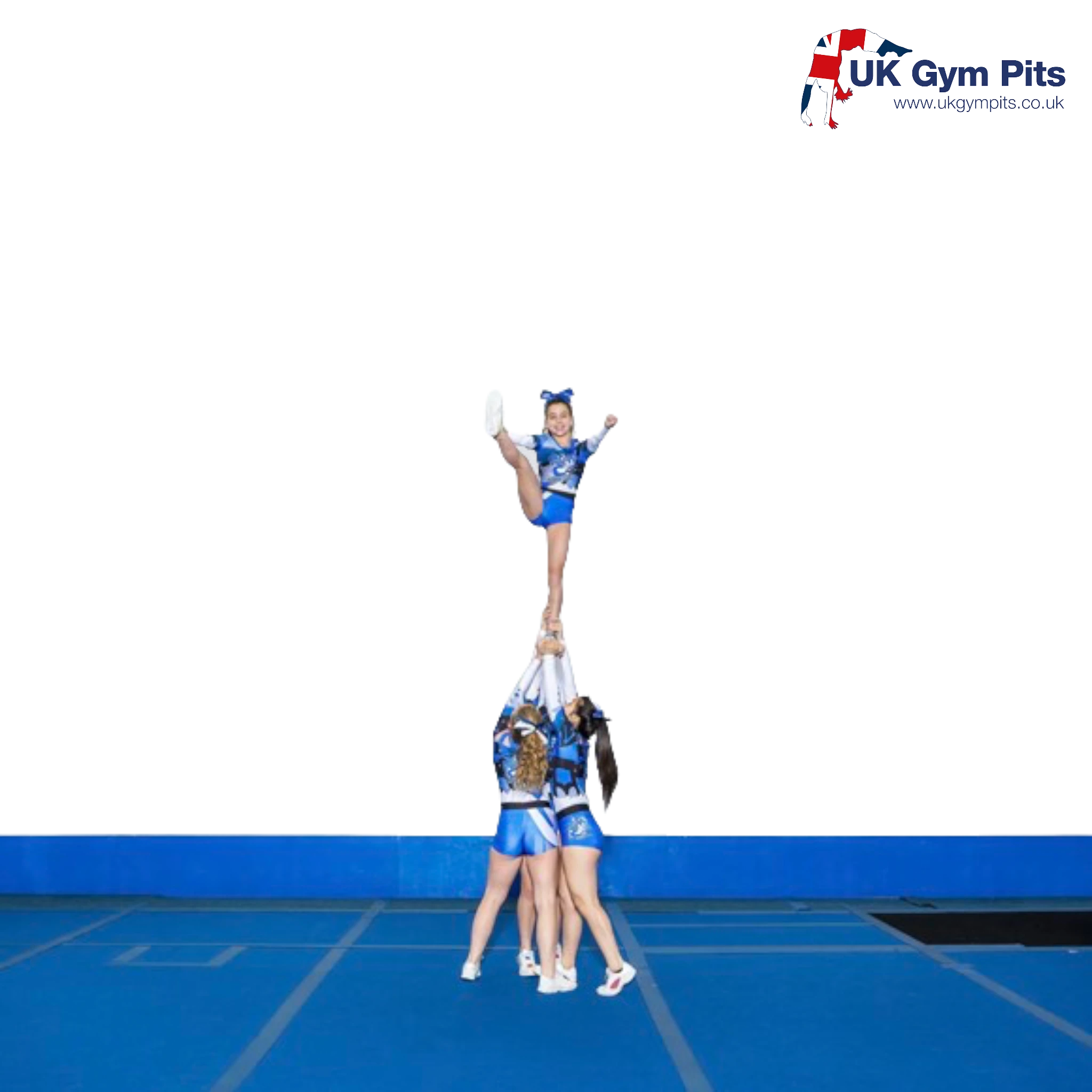UK Gym Pits cheerleaders performing a stunt on a large blue sprung floor with shock-absorbent carpet surface