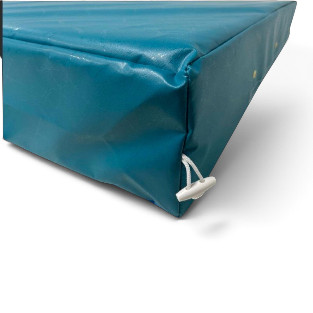 UK Gym Pits blue PVC crash mat with white toggle connector for joining multiple mats for gymnastics and parkour.