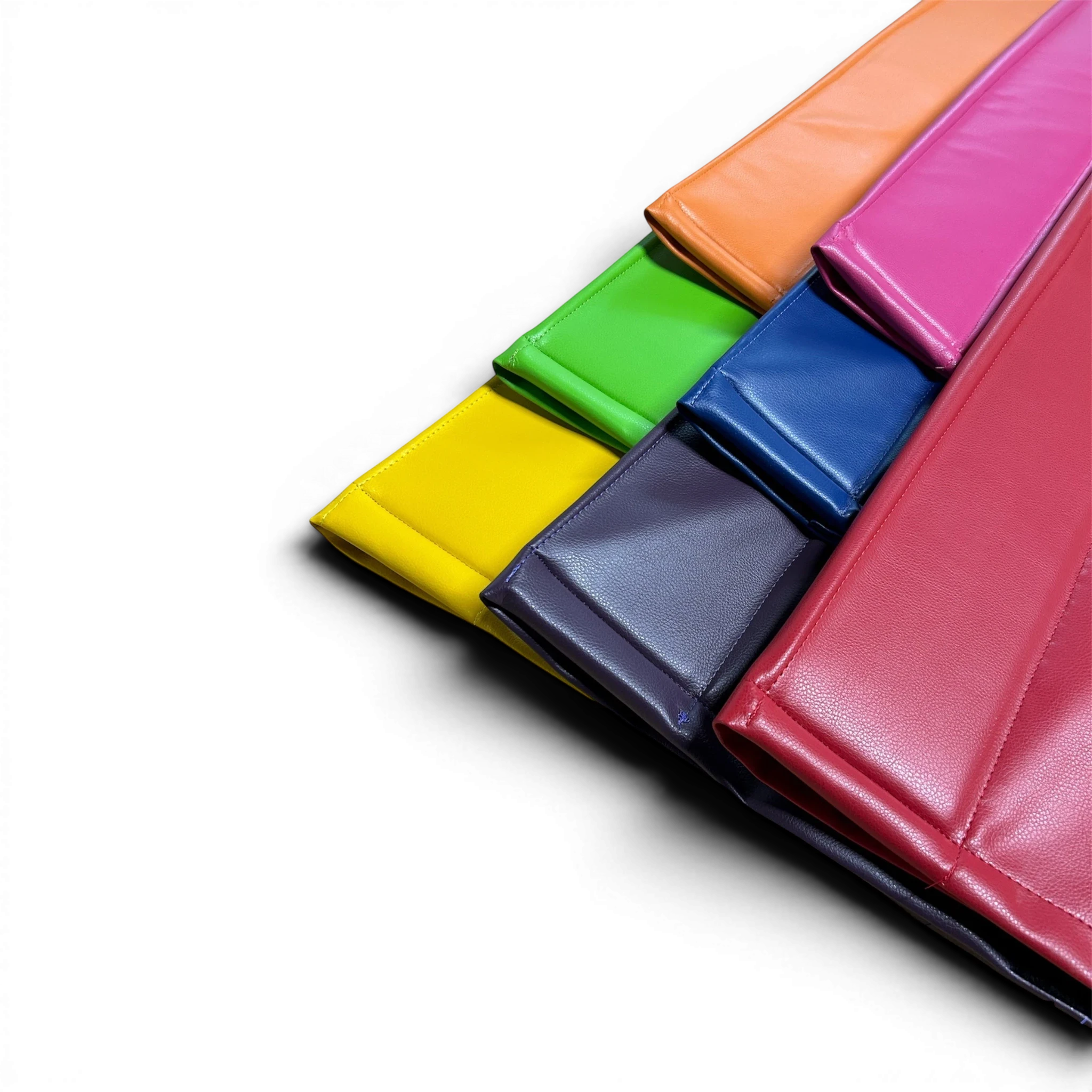 UK Gym Pits cushioned beam mats in various vibrant colours featuring anti-slip faux leather for gymnastics training.