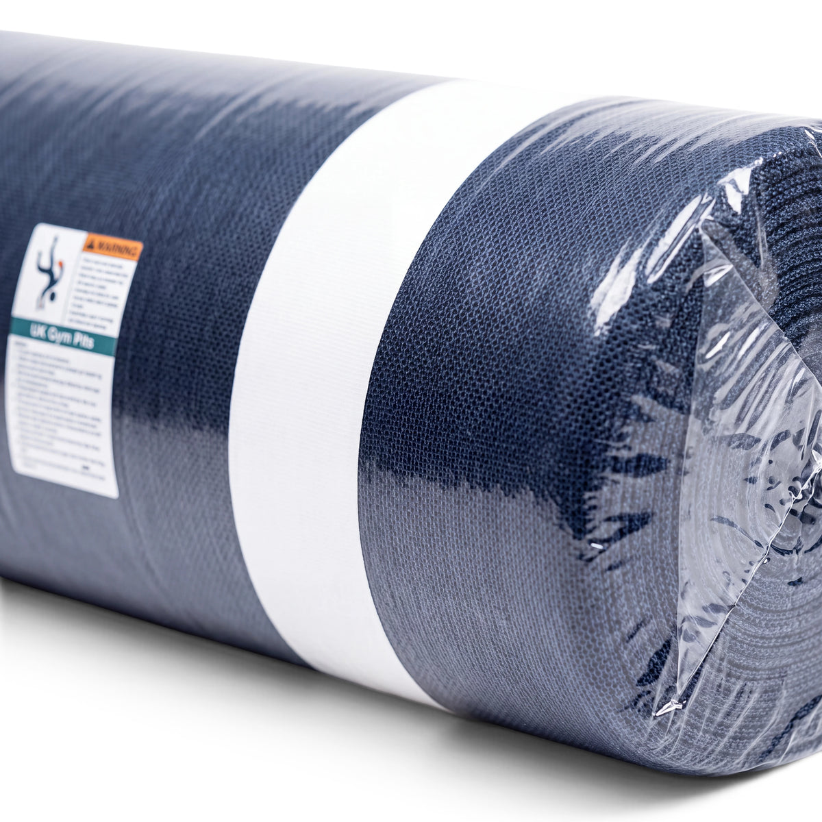 UK Gym Pits soft denim topper mat rolled in plastic packaging with a white center line for gymnastics training
