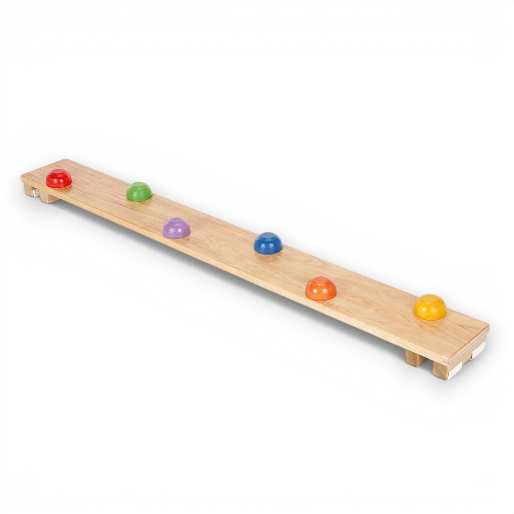 UK Gym Pits activ dome plank with natural timber finish and colourful sensory domes for children's gymnastics training.