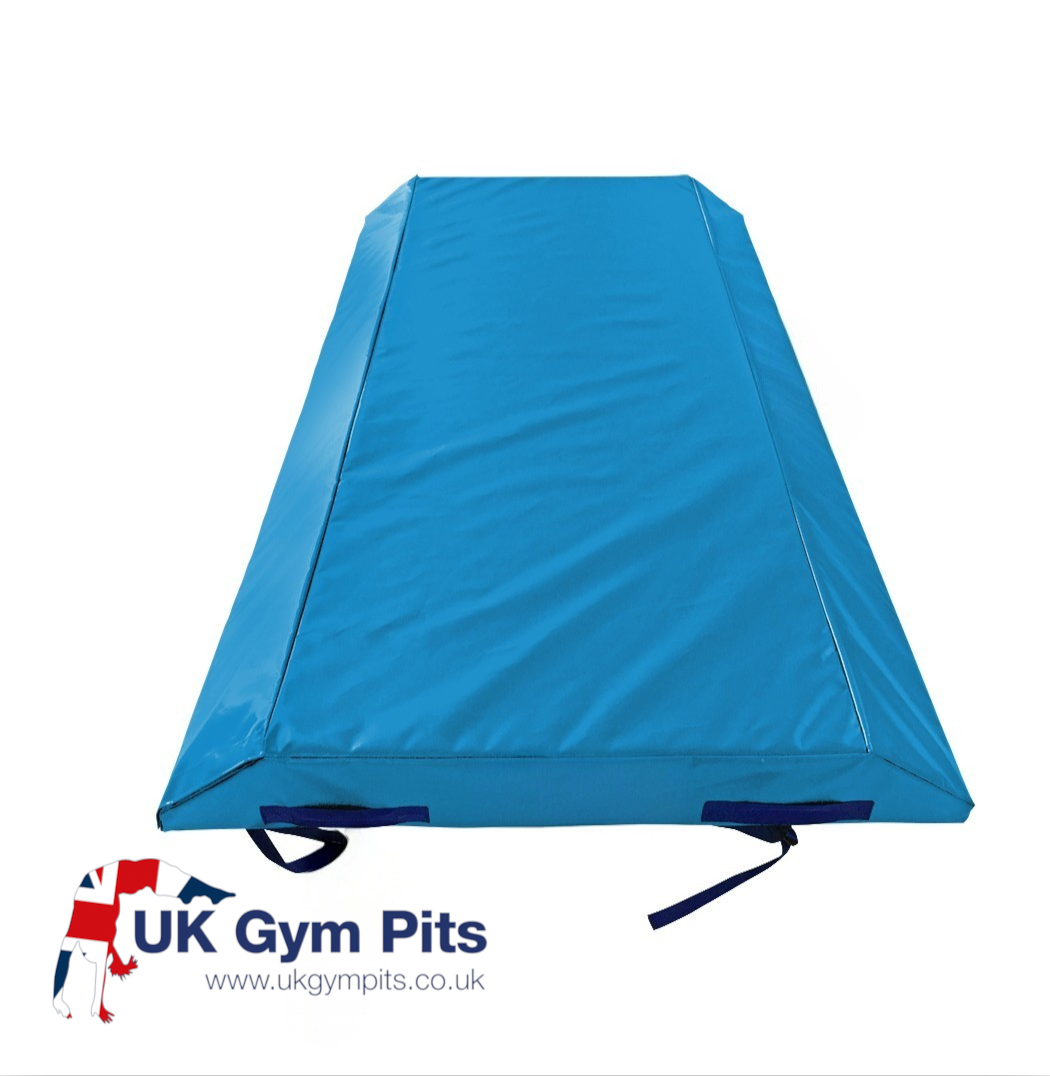 UK Gym Pits blue double wedge trampoline spotting end deck mat with reinforced PVC cover and secure webbing straps.