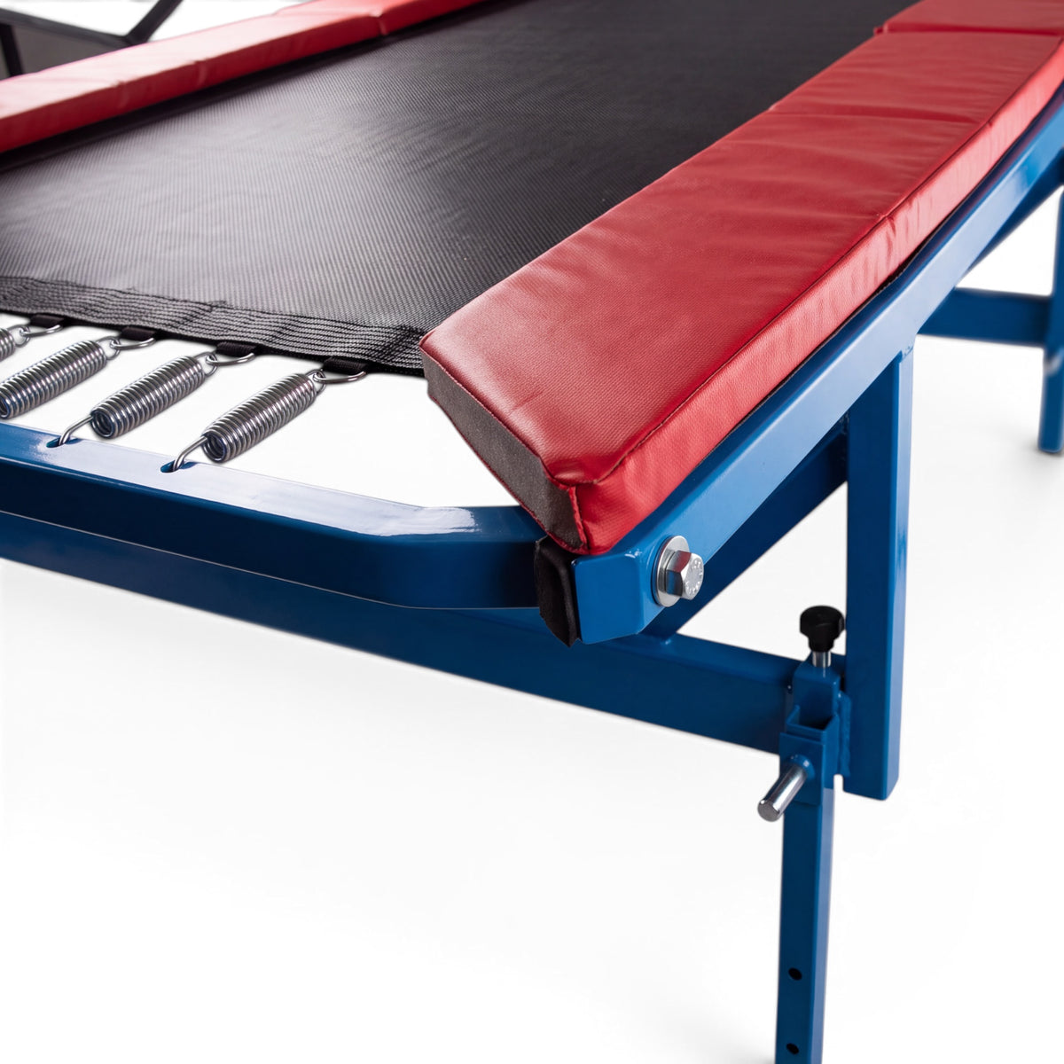 UK Gym Pits Downhill Inclines attachment on a blue metal frame with red padding and black tumbling mat surface