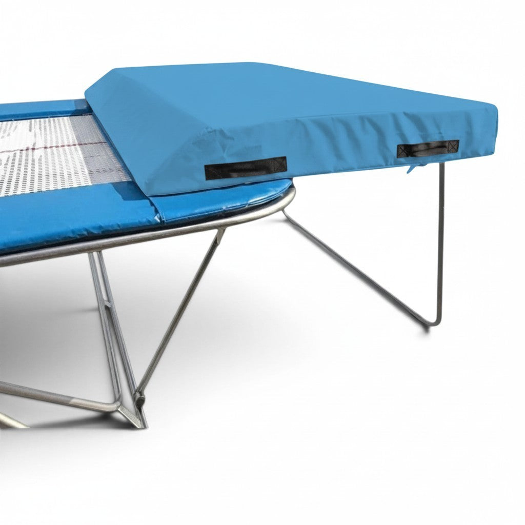 UK Gym Pits economy blue spotting end deck with silver frame and wedged safety mat attached to a trampoline