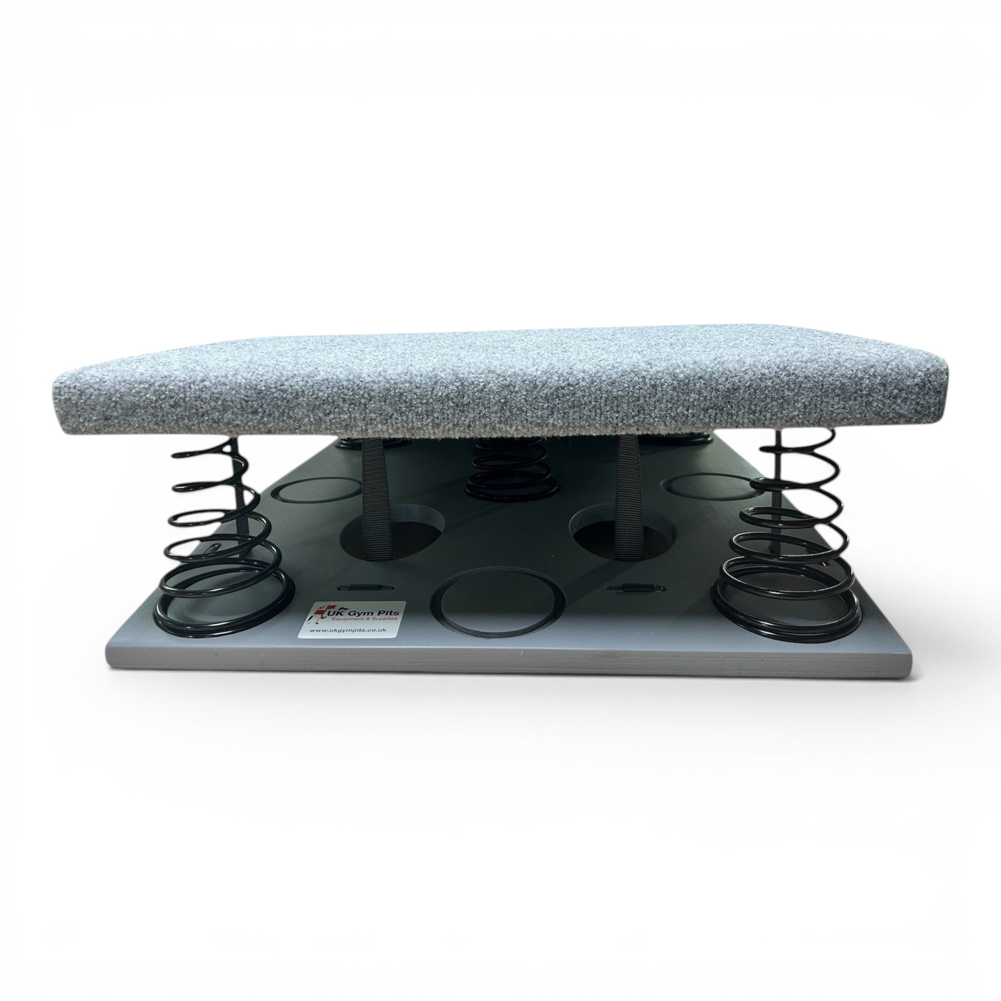 UK Gym Pits FIG approved gymnastics springboard with grey carpeted surface and heavy-duty tapered springs