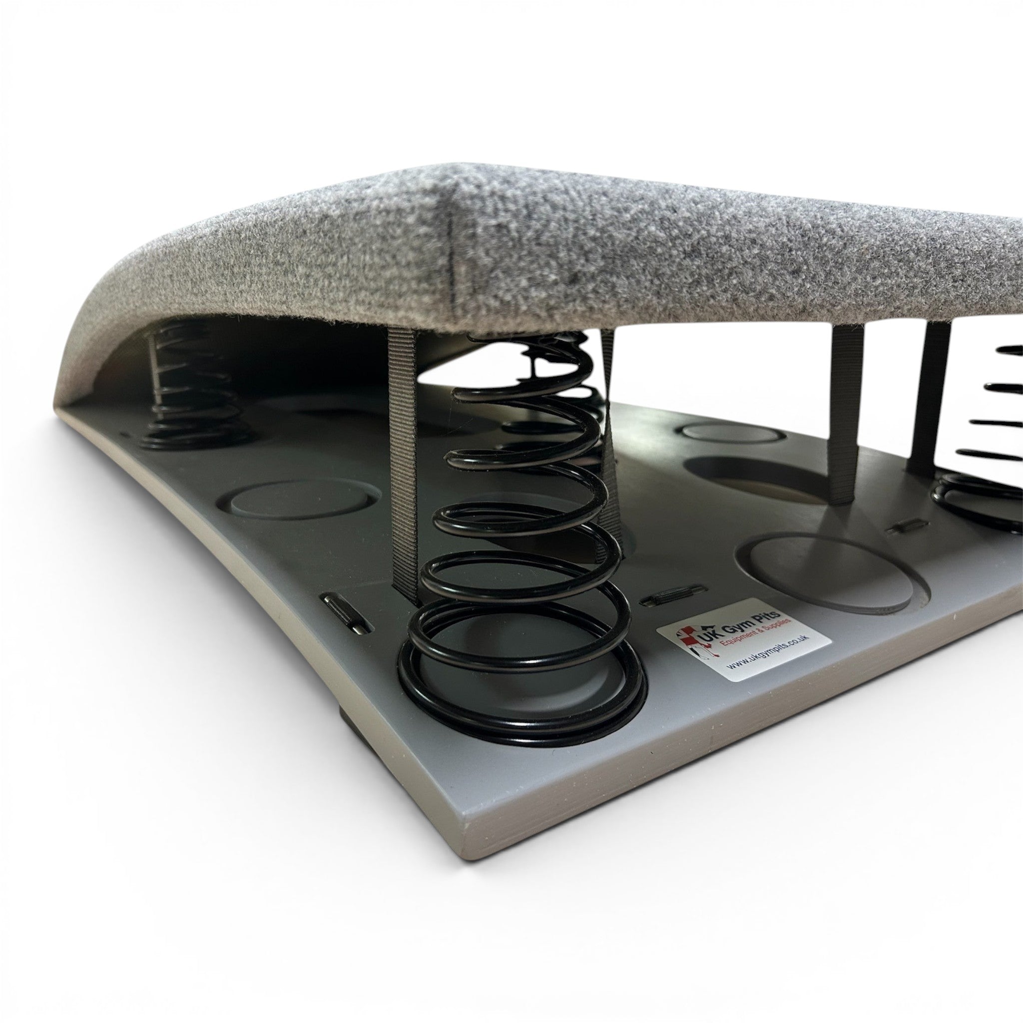 UK Gym Pits FIG approved gymnastics springboard with grey carpeted surface and black tapered springs