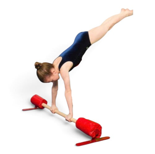 UK Gym Pits floor bar with red foam pads being used by a gymnast in a handstand position for training drills