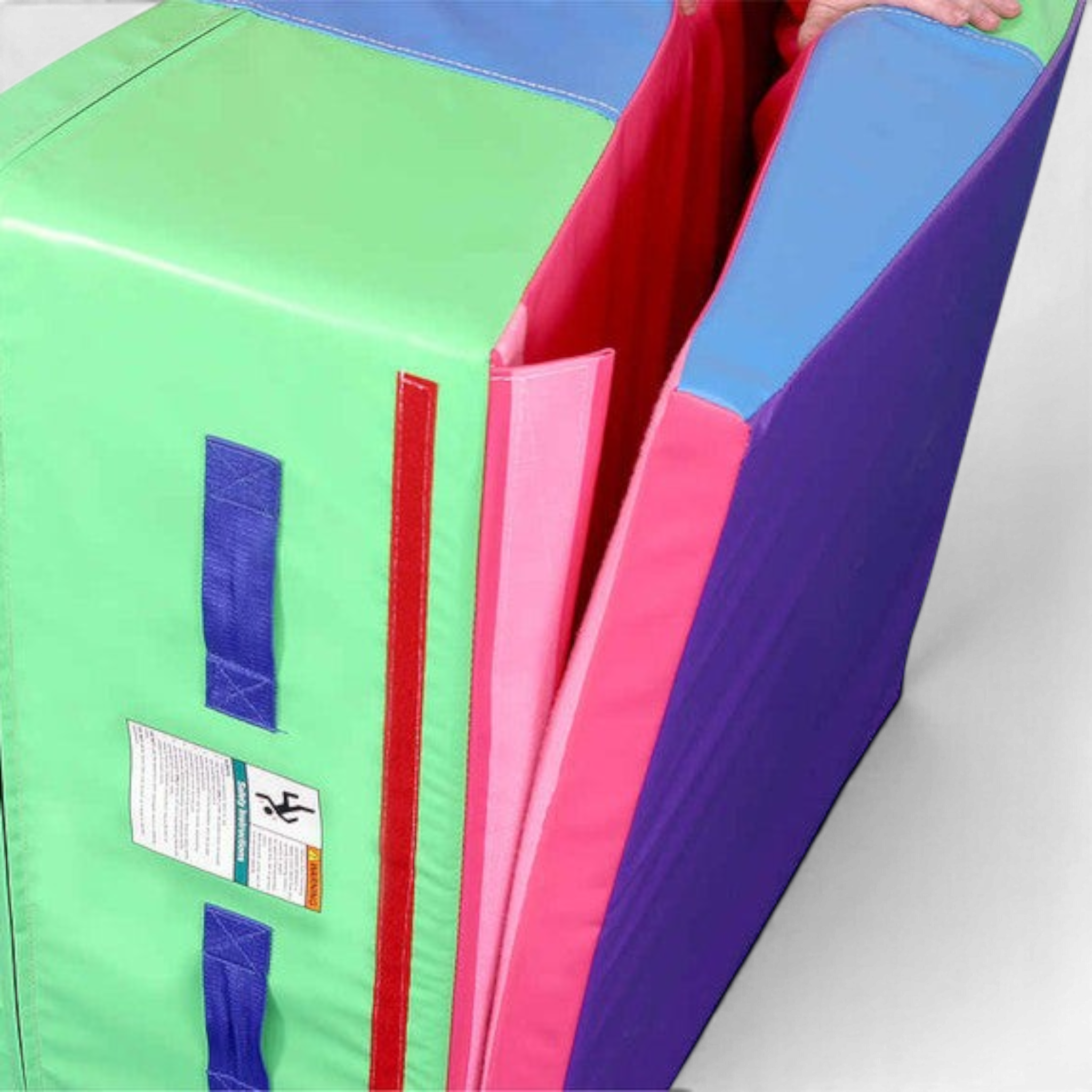 UK Gym Pits folding incline gymnastics wedge mat in multi-coloured vinyl with heavy duty webbing handles