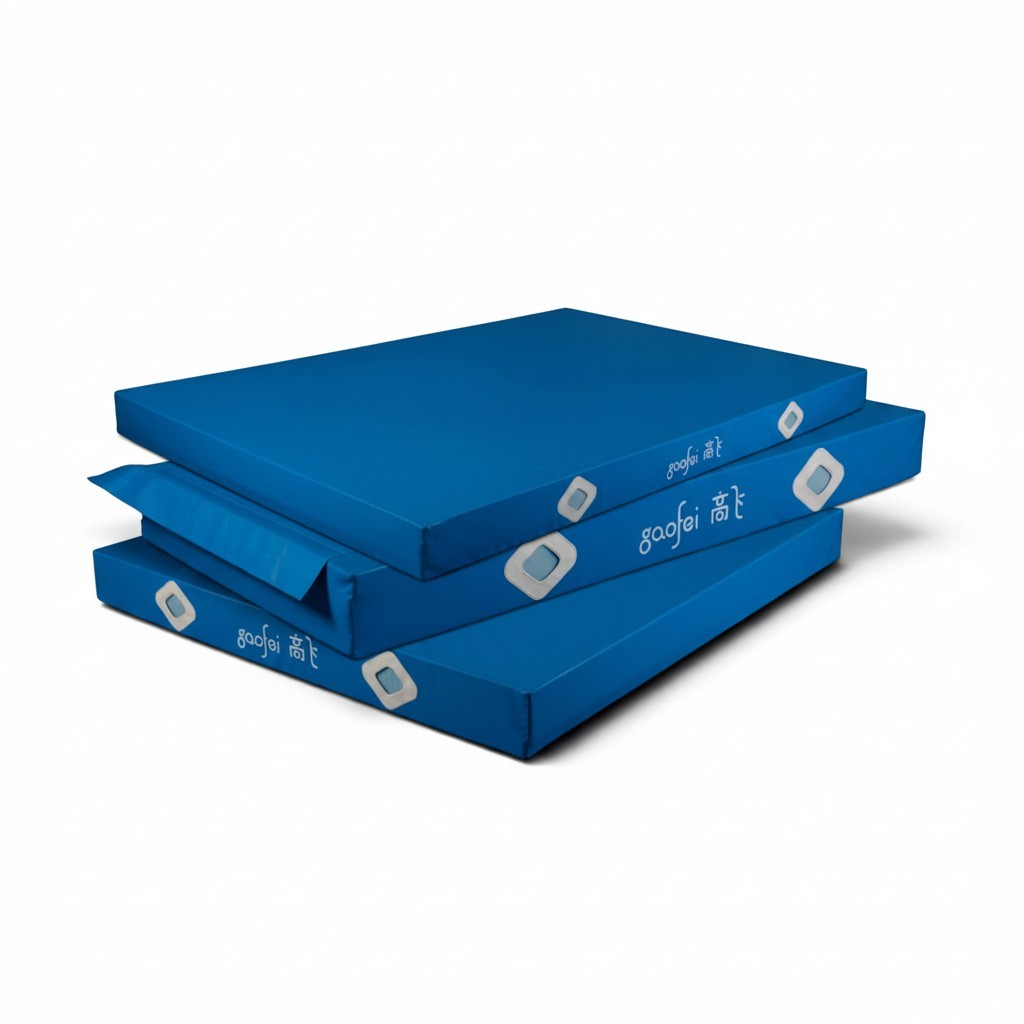 UK Gym Pits Gaofei blue gymnastics landing mats stacked, featuring durable PVC vinyl and air distribution mesh.