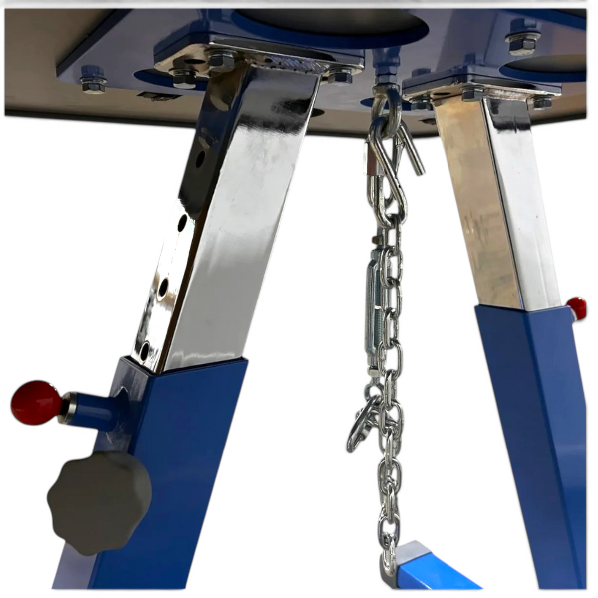 UK Gym Pits floor chain tension system attached to a blue and chrome gymnastics pommel horse or vault base