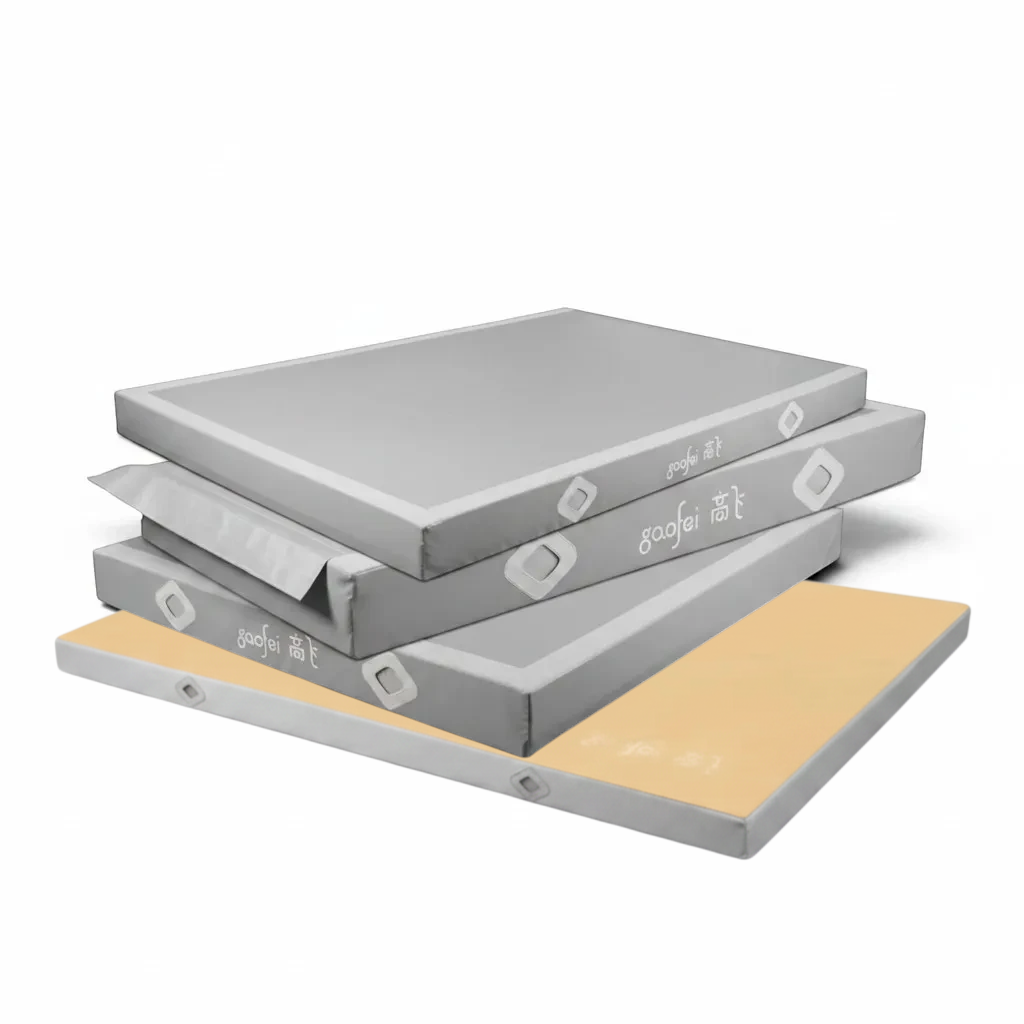UK Gym Pits Gaofei grey and beige gymnastics landing mats stacked, featuring durable PVC vinyl and air mesh windows.
