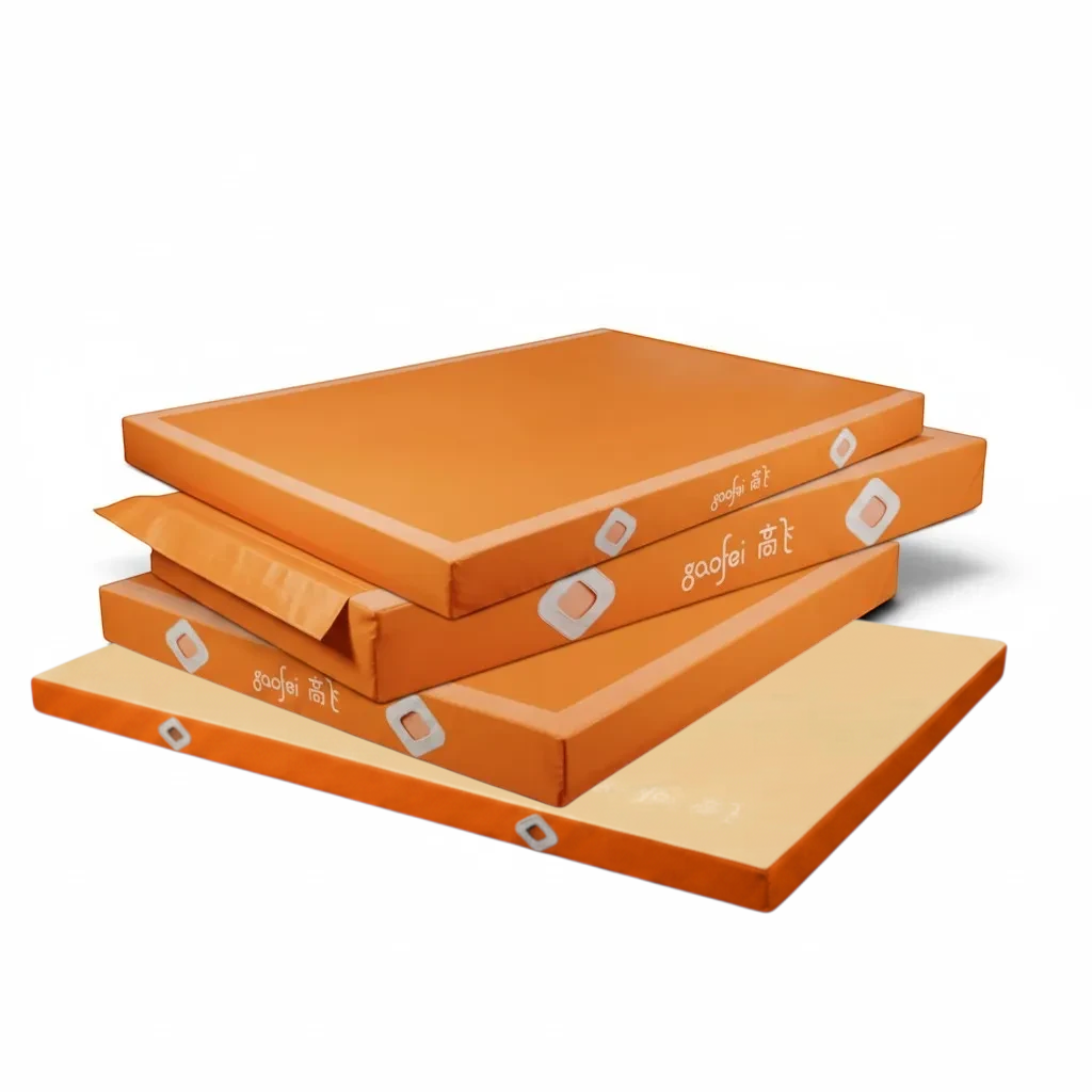 UK Gym Pits Gaofei orange gymnastics landing mats stacked, featuring durable PVC vinyl and air distribution mesh.
