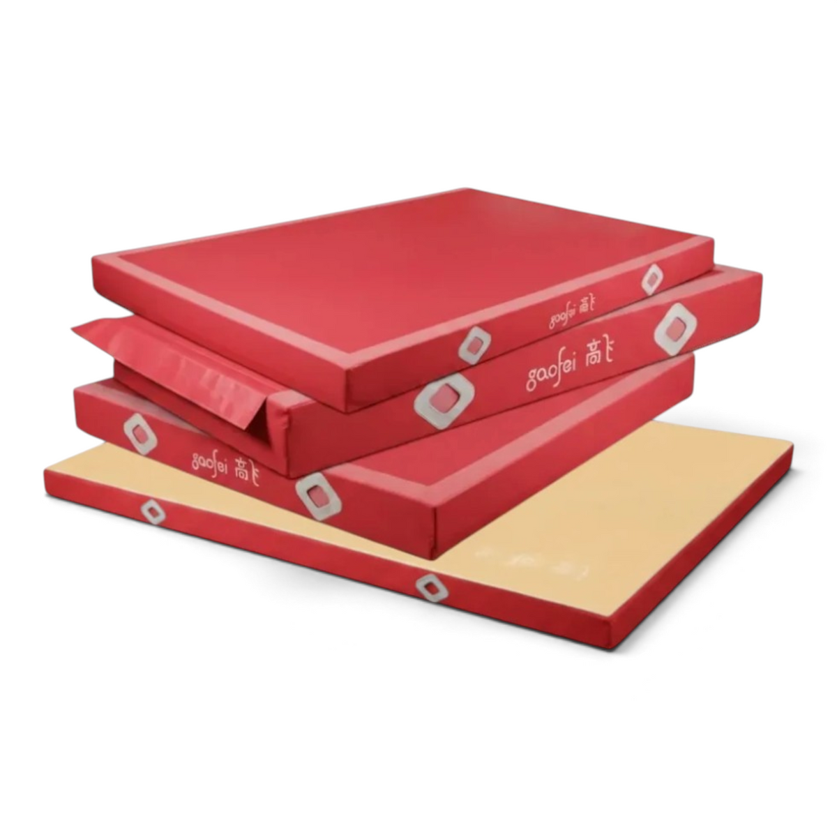 UK Gym Pits Gaofei FIG approved red gymnastics landing mats stacked for training and competition use.
