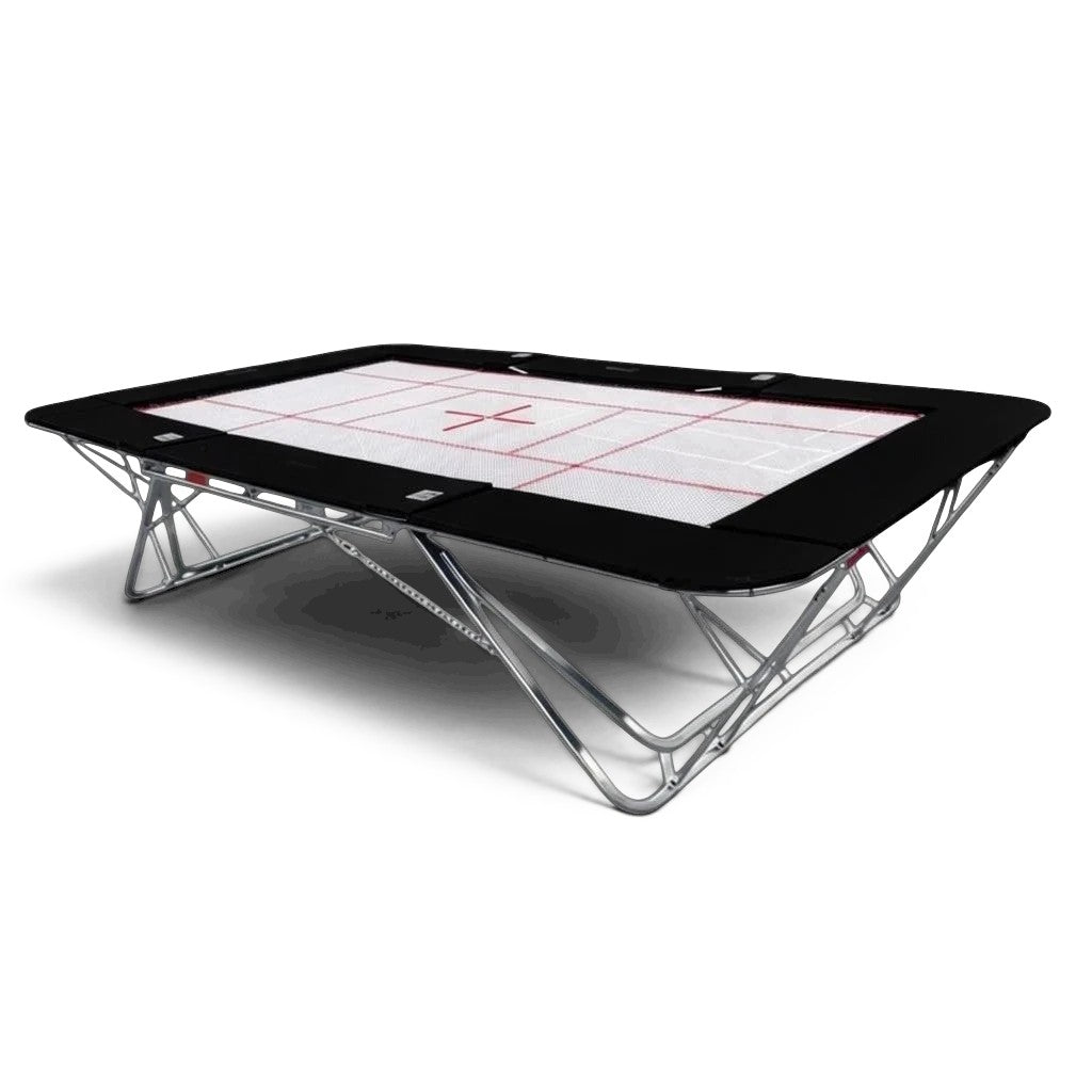UK Gym Pits GM Extreme competition trampoline with a 4mm by 6mm web bed and black frame pads on a black background.