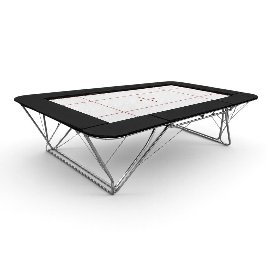 UK Gym Pits GM Extreme competition trampoline with a 6mm white web bed and black protective frame pads.