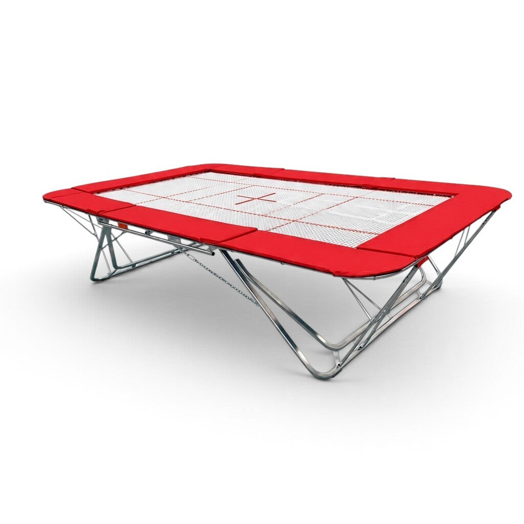 UK Gym Pits GMEX Extreme competition trampoline with a white web bed and vibrant red protective frame pads