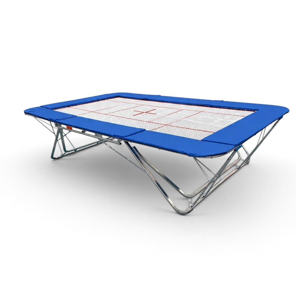 UK Gym Pits GMEX Extreme competition trampoline with a white web bed and blue protective frame pads on a white background