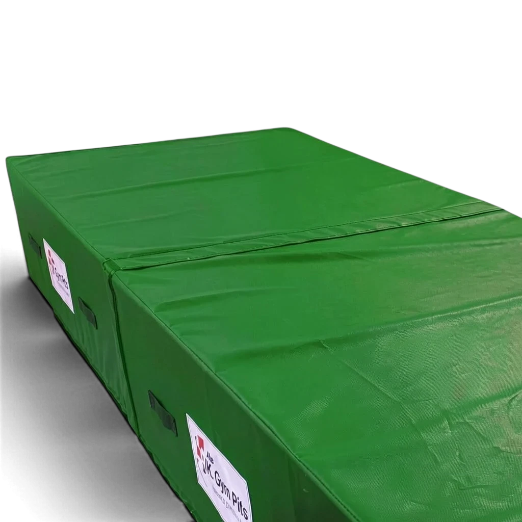 UK Gym Pits green heavy-duty foam track run-up block with reinforced PVC cover, handles, and anti-slip base.