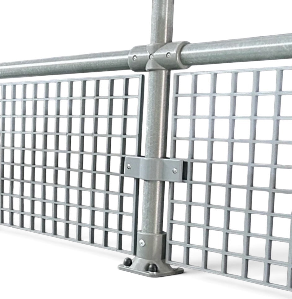 UK Gym Pits grey GRP mesh safety panel installed on a metal handrail system for fall protection