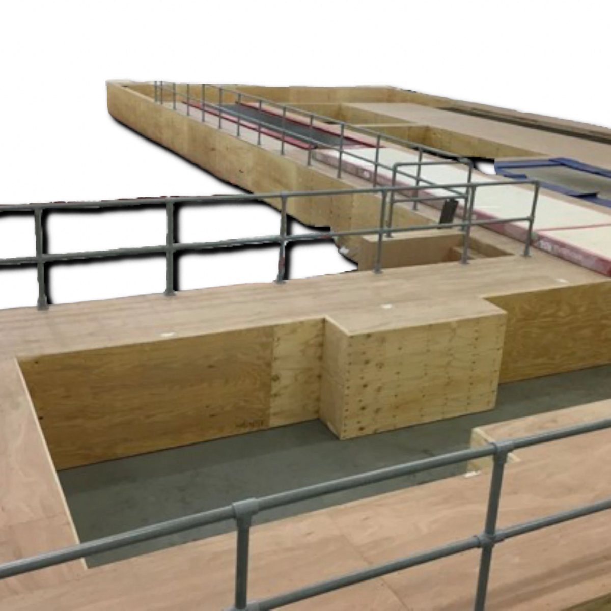 UK Gym Pits grey GRP side fitting base plate installed on a wooden gym pit podium handrail system
