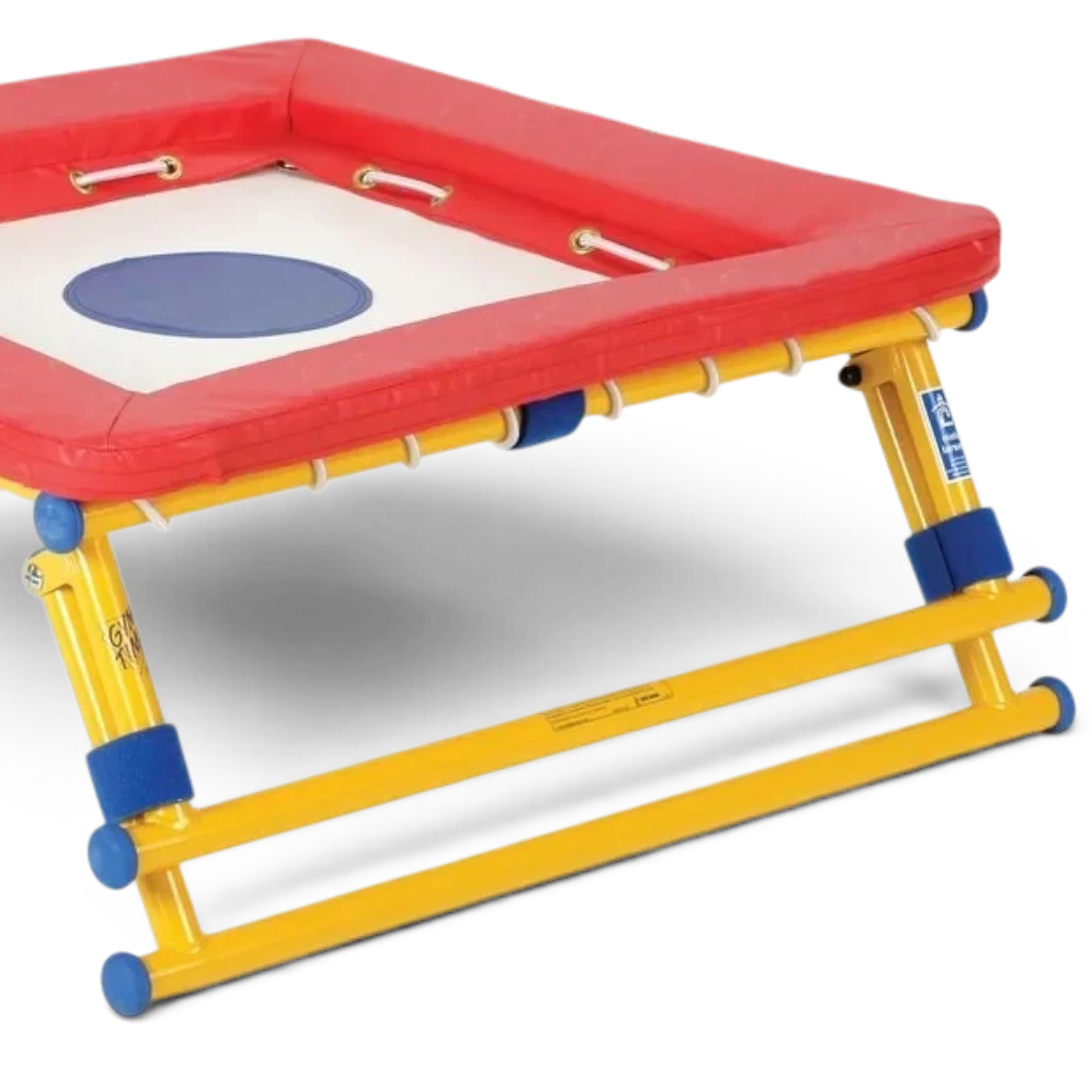 UK Gym Pits Gym Time Bouncer with a white jumping bed, red foam padding, and a yellow powder-coated steel frame.
