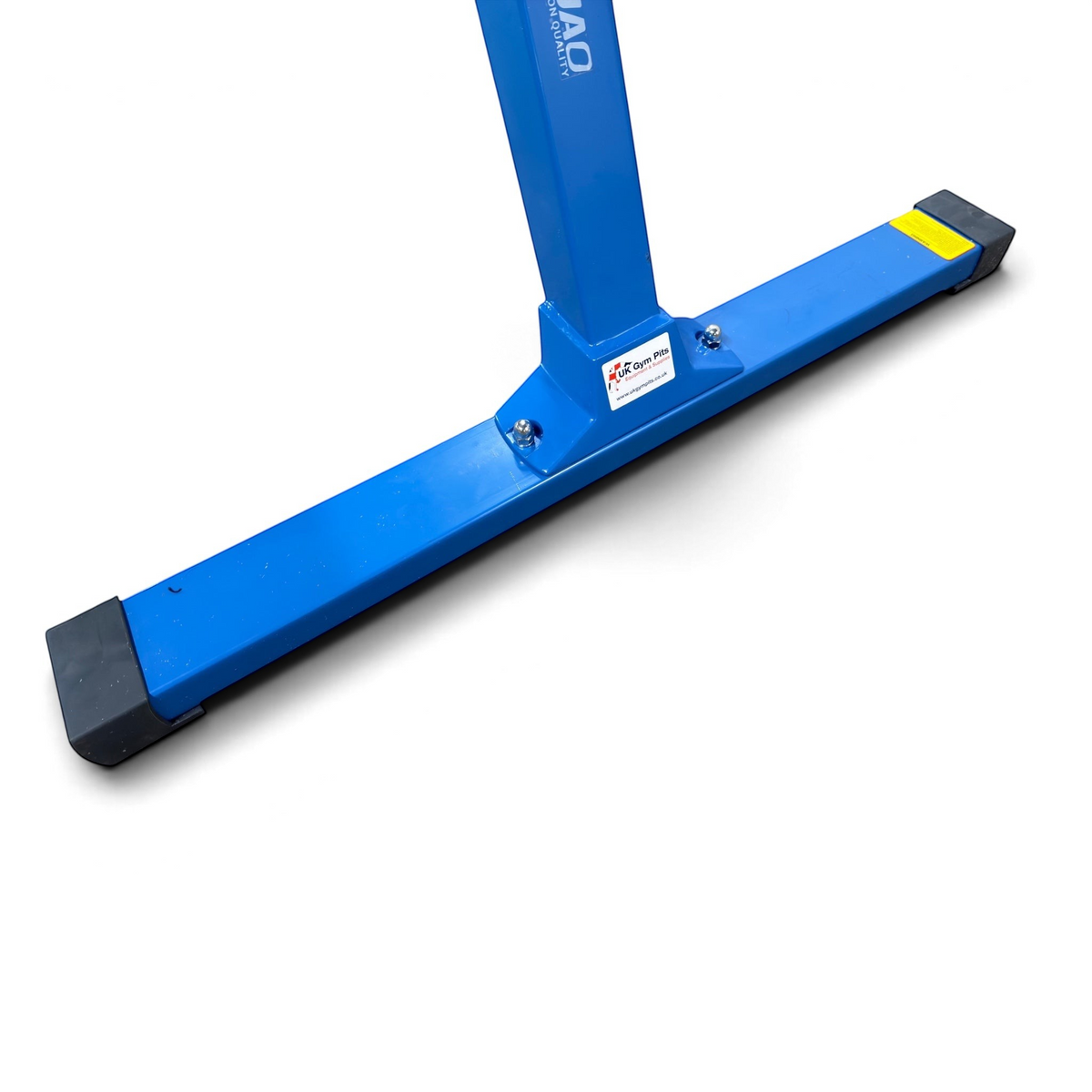 UK Gym Pits blue powder-coated steel base of a gymnastics beam with non-marking rubber feet and brand logo sticker