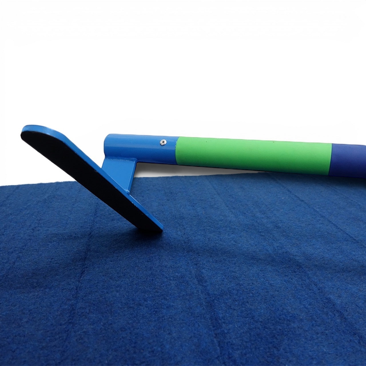 UK Gym Pits gymnastics floor bar with colourful rubberised segments on a blue carpet surface for hand placement training