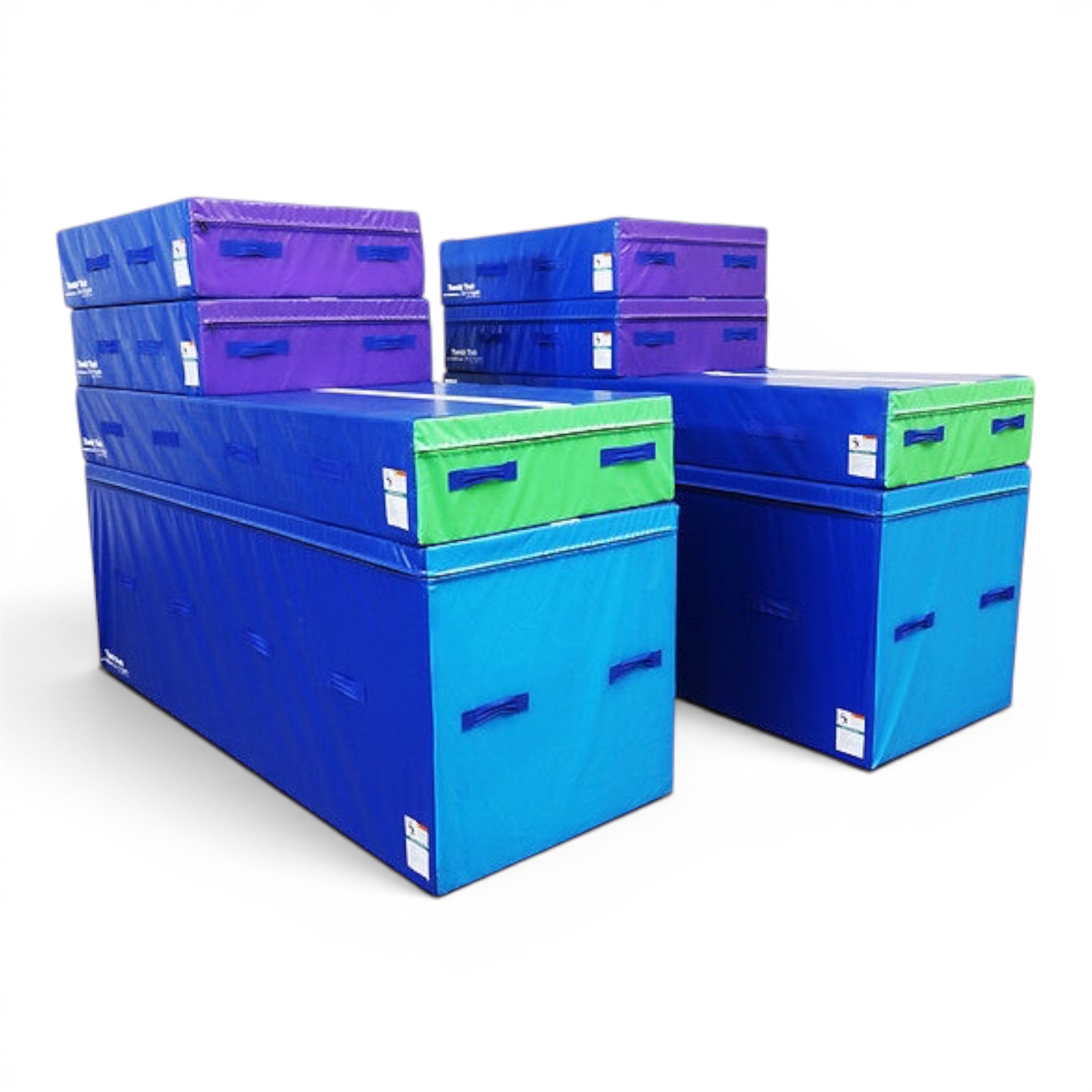 UK Gym Pits smart spotting blocks in blue, purple, and green vinyl foam for gymnastics training and skill progression.