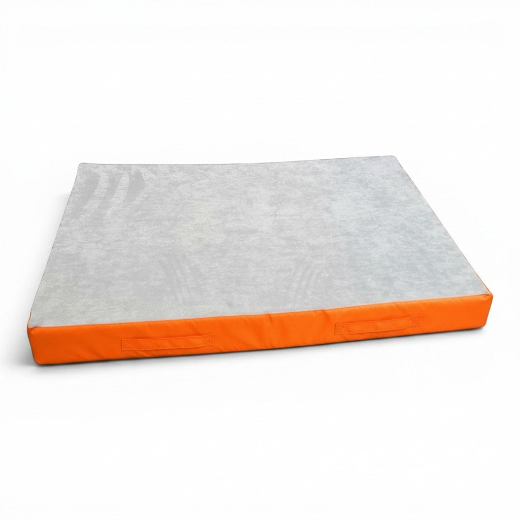 UK Gym Pits jersey topped crash mat with a grey fabric surface and orange PVC sides for gymnastics and parkour.