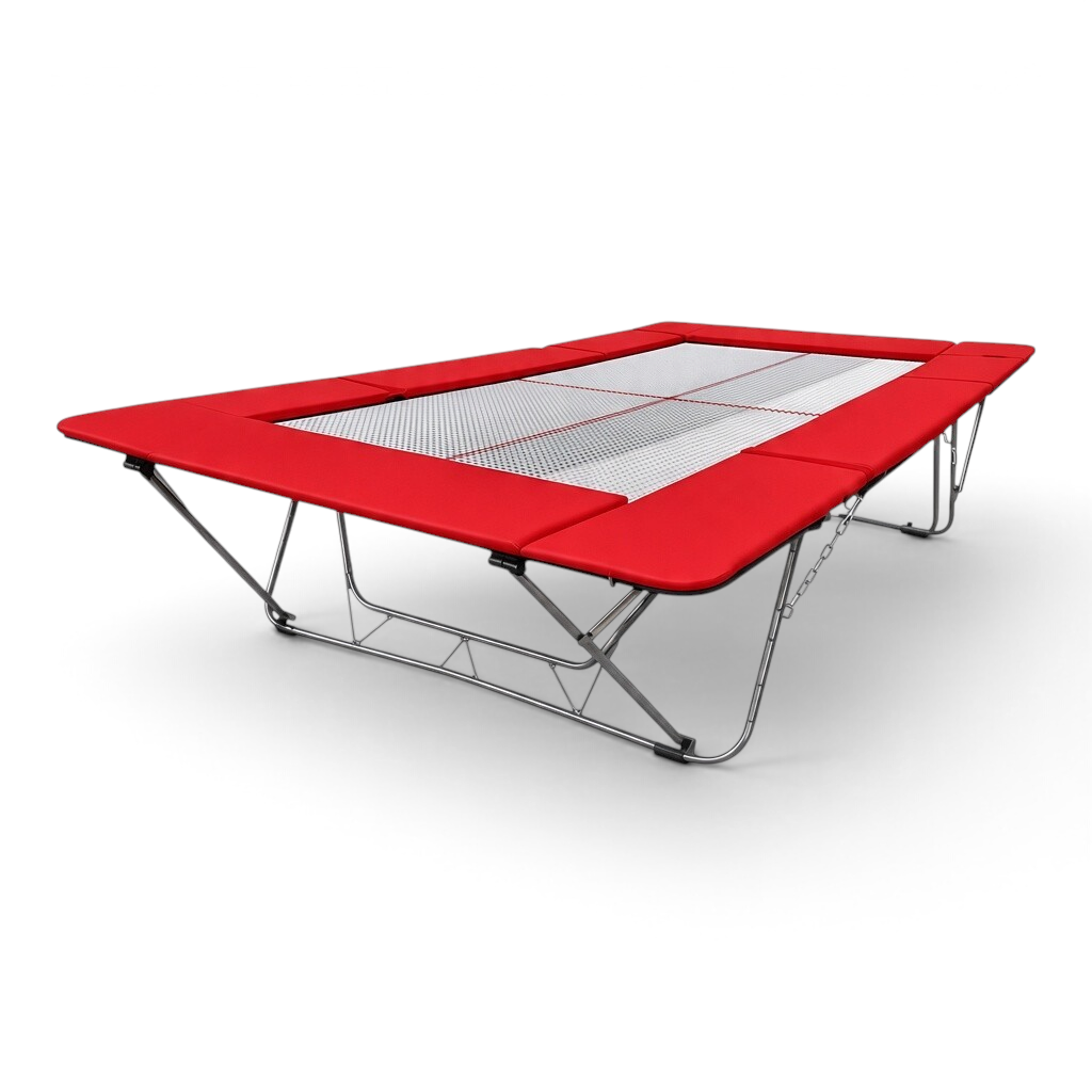 UK Gym Pits junior trampoline with a white web bed and bright red protective frame pads for gymnastics training