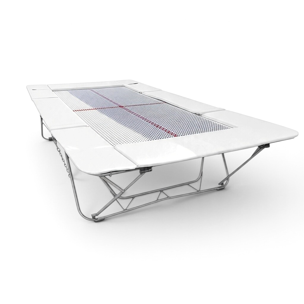 UK Gym Pits junior trampoline with white frame pads and a webbed jumping bed on a steel frame for gymnastics training