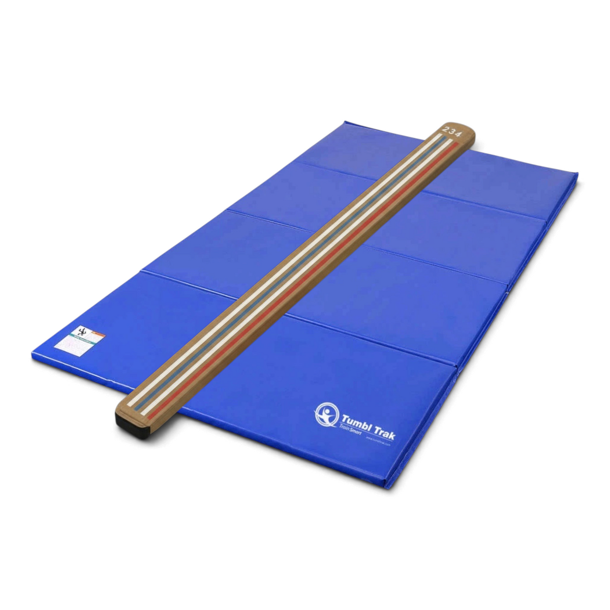 UK Gym Pits laser balance beam with marked lines on a blue folding tumbling mat for gymnastics training.