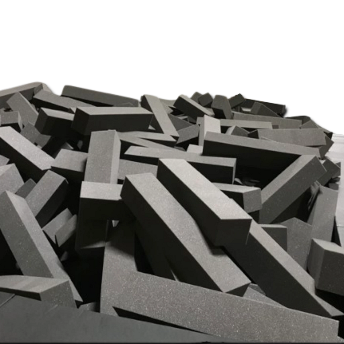 UK Gym Pits loose grey foam logs for gymnastics landing pits, designed for durability and fire safety.