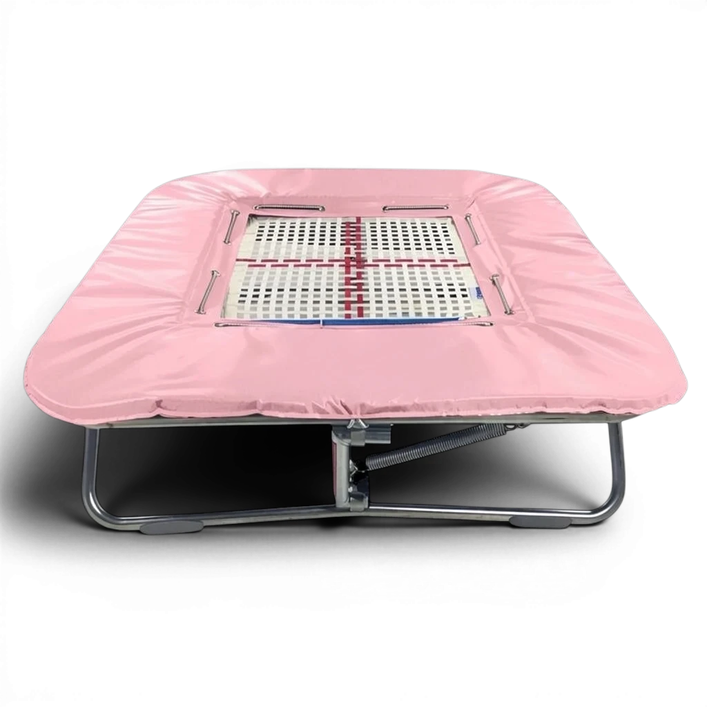 UK Gym Pits super mini trampoline with a web bed and pink protective frame pads on a black background
