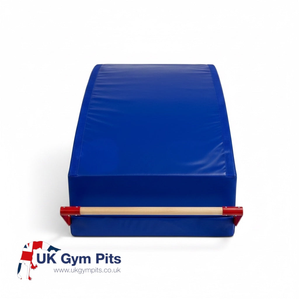 UK Gym Pits gymnastics mountain bar system with blue sloping foam mat and beech wood rail on a white background