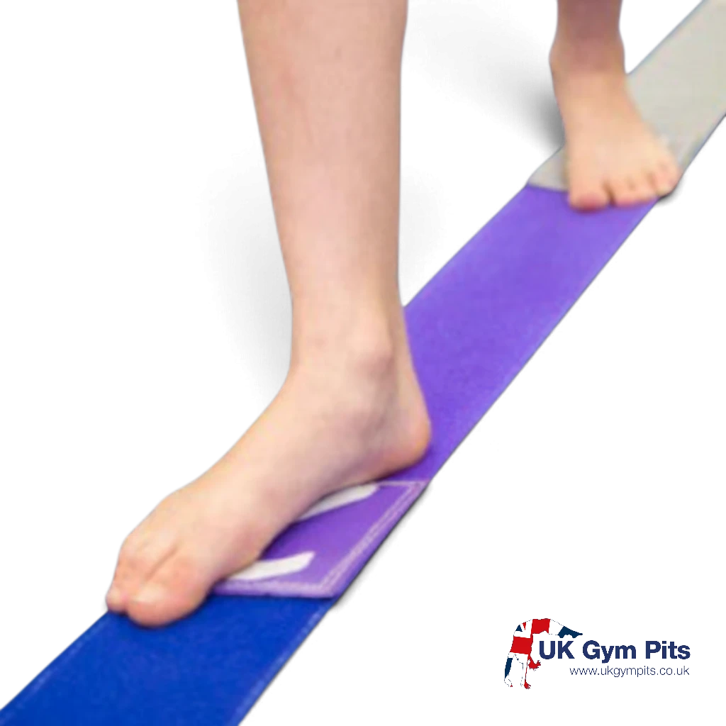 UK Gym Pits multi-coloured tumble tape with Velcro surface being used by a gymnast for balance and tumbling practice